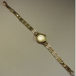 A lady's 9ct gold Victor watch with 9ct strap