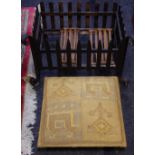 A cast iron dog grate; a foot stool,