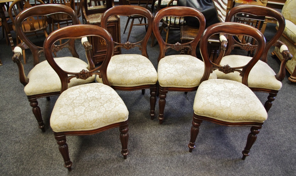 A set of six Victorian mahogany balloon back dining chairs, including two carvers, horizontal splat,