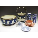 A Wedgwood Jasperware silver plated mounted fruit bowl; a biscuit barrel; a boudoir candlestick;