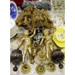 Curtain ties; gilt metal figural wall lights; curtain rings;