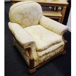 A pair of Victorian armchairs, floral golden upholstery squab cushion.