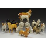 A Beswick Cairn terrier; others including Fox Terriers, Golden Retriever, Standard Poodles,