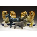 A pair of Staffordshire Pekingese mantel dogs; Russian ceramic model of a Kerry Blue; another grey;