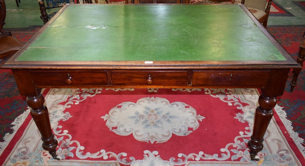 A Victorian mahogany partners writing table,