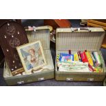A Revelations suitcase; prints; display cabinet; knitting needles; children's' books;