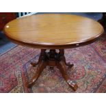 A Victorian mahogany loo table, oval top, deep frieze, four turned columns underfinial,