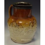 A 19th century brown and buff salt glazed stoneware ovoid jug, sprigged with jolly topper,