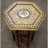 An Eastern hall table profusely inlaid with mother of pearl and ebony throughout,