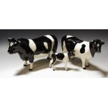 A Beswick Freisian Cattle family, Bull 1439, Cow 1362 and Calf 1249, printed mark,