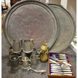 Two large copper Eastern chargers; a Moorish brass coffee pot; eight pewter tankards;