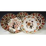 Three Royal Crown Derby 1128 dinner plates; a Royal Crown Derby 383 plate; another,