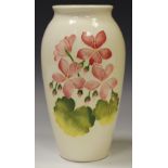 A Moorcroft ovoid vase, tube lined with flowers,