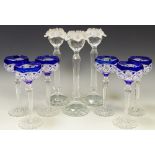 Three Swarovski 'silver crystal' pattern candlesticks terminating in frosted flower heads;