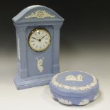 A Wedgwood blue jasper mantel clock, sprigged in white,