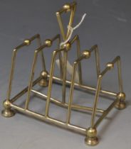 A silver plated toast rack in the manner of Christopher Dresser, by Hukin and Heath,