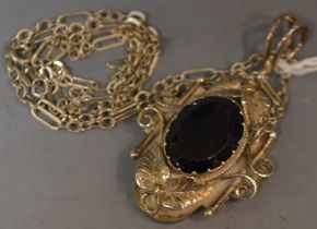 An ornate silver amethyst pendant,