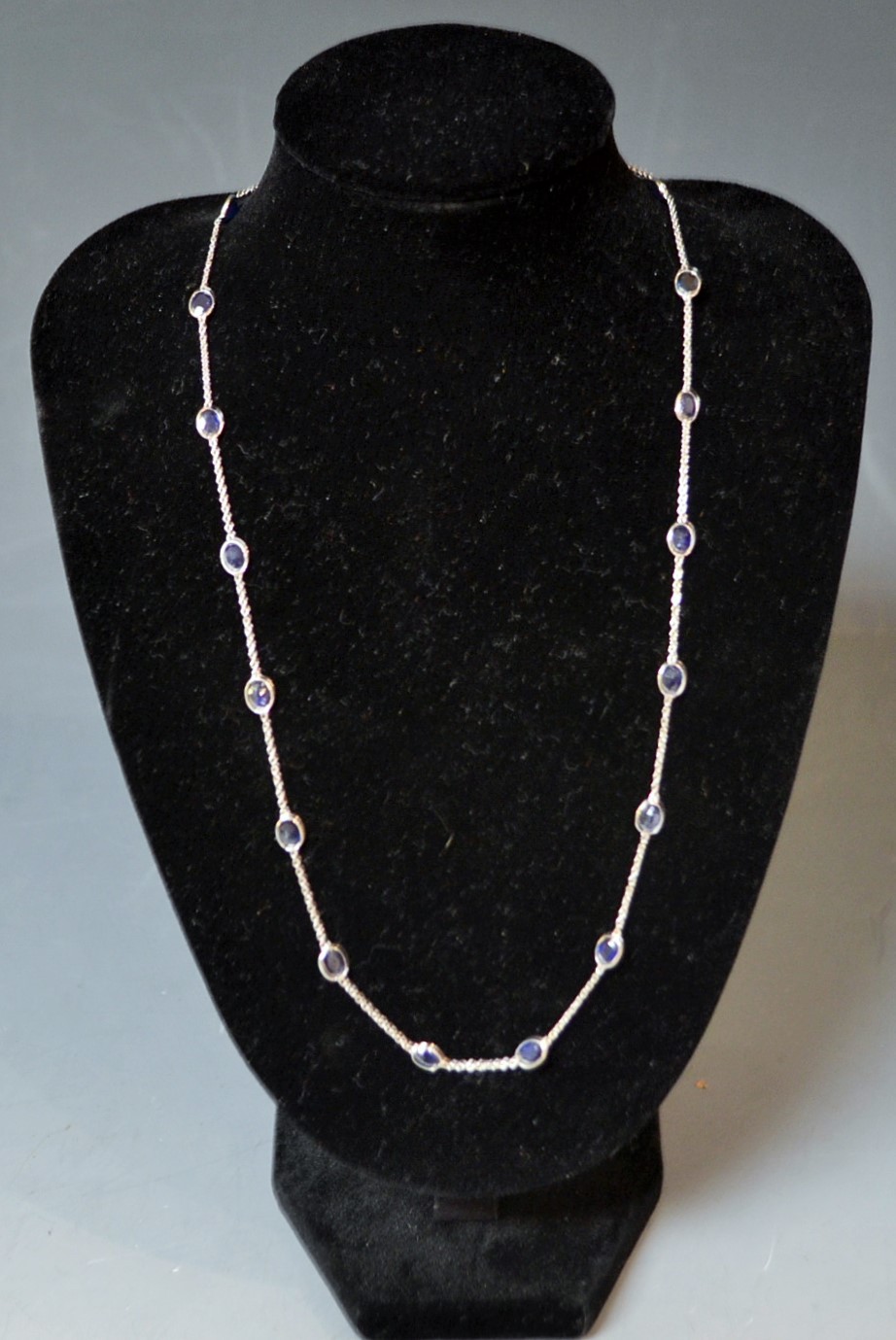 A contemporary modern design deep blue black stone inset white gold necklace,