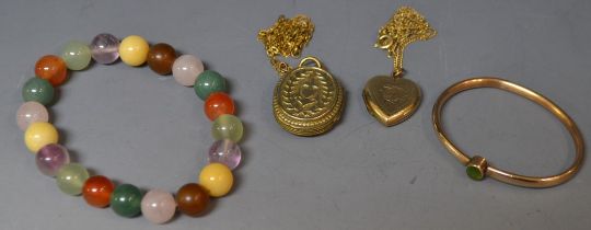A Victorian anchor and heart locket; an agate bracelet;