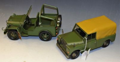 A reproduction pressed metal model, of a Jeep; another, similar, Jeep 4x4,