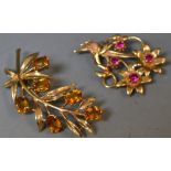 Brooches - a 9ct gold citrine leaf spray brooch,