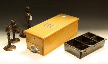 An early 20th century cash box with bell; a Bakelite table lamp with ashtray; a cash tray;