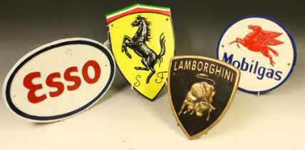 A set of four reproduction cast metal advertising signs, Lamborghini, Ferrari,