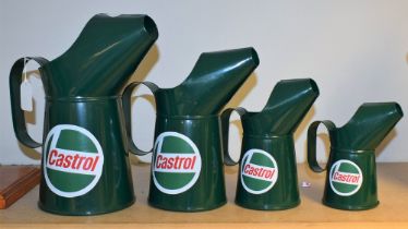 A graduated set of four reproduction metal oil jugs, advertising Castrol, the largest 27.