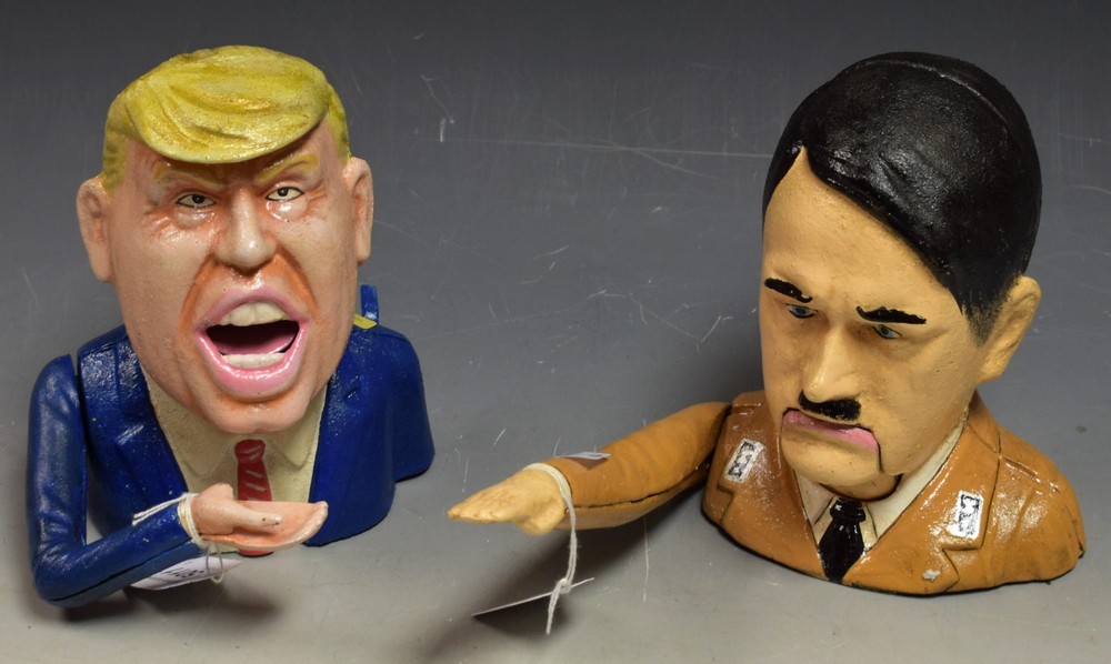 A reproduction cast metal money box, in the form of Donald Trump; a similar nutcracker,