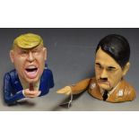 A reproduction cast metal money box, in the form of Donald Trump; a similar nutcracker,