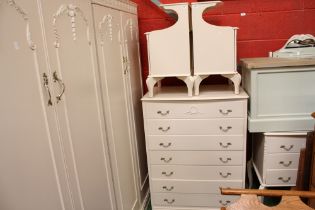 A contemporary matched French style bedroom suite comprising two wardrobes, dressing chest,