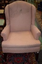 A George III design wingback reception armchair, scroll arm,