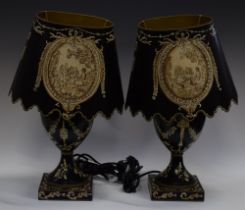 A pair of black toleware type table lamps and shades (2)