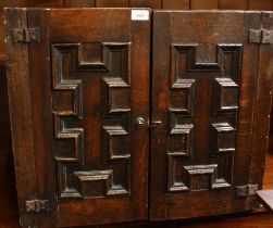 A Jacobean Revival oak tabletop/wall hanging cabinet,