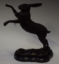 A bronzed metal sculpture, as a boxing hare, 29.
