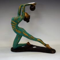 An Art Deco style bronze figure, as a ballet dancing girl with ball, green and gilt painted costume,