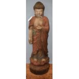 A painted wooden Thai buddha,