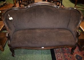 A French Hepplewhite style mahogany framed sofa, shaped back terminating in scroll hand rests,