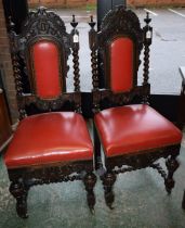 A pair of Carolean Revival oak hall chairs (2)