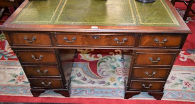 A mahogany twin pedestal writing desk