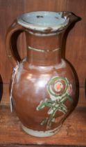 A large stoneware jug, by Stanislas Reychan, salt glazed in shades of brown, pink and green,