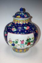 A Chinese blue and pink Famille Rose jar and cover,