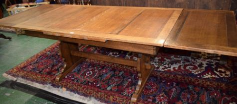 A large oak drawleaf dining table,