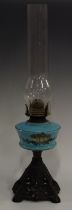 A Victorian blue milk glass and enamelled oil lamp