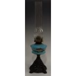 A Victorian blue milk glass and enamelled oil lamp