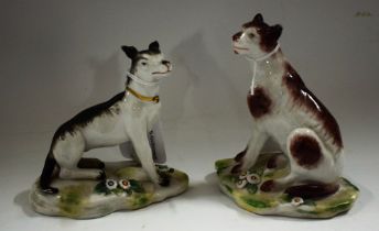 A pair of German porcelain models, of seated dogs,