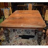 A Victorian mahogany extending dining table, rounded rectangular top,