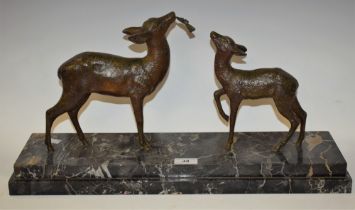 An Art Deco French bronzed sculptural group, Doe and Faun, naturalistically modelled,