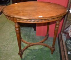 A Louis XVI design mahogany occasional table, moulded eliptical top,