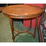 A Louis XVI design mahogany occasional table, moulded eliptical top,